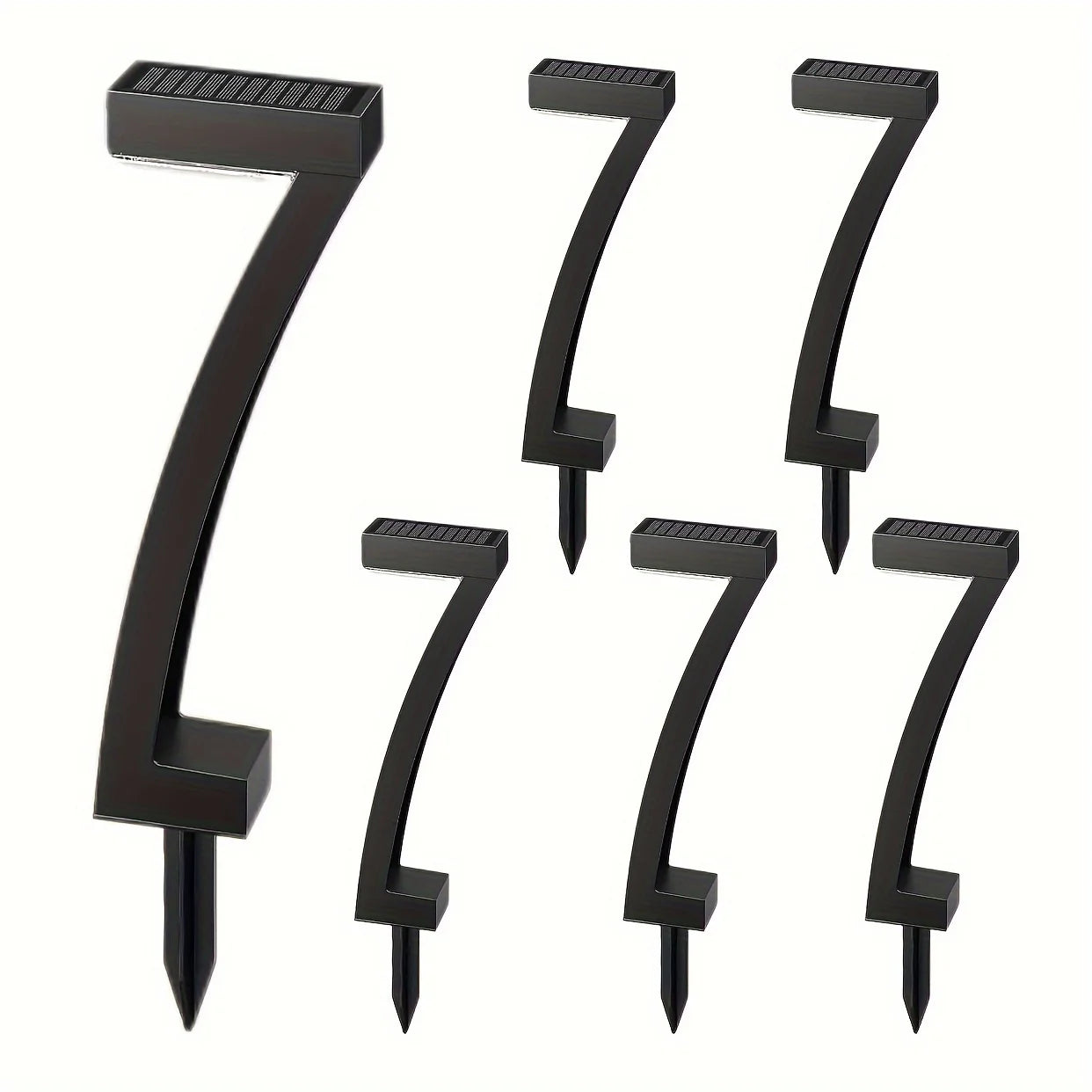 Set of black metal house numbers on a white background
