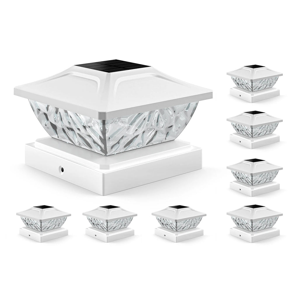 Set of solar post lights with decorative design on a white background